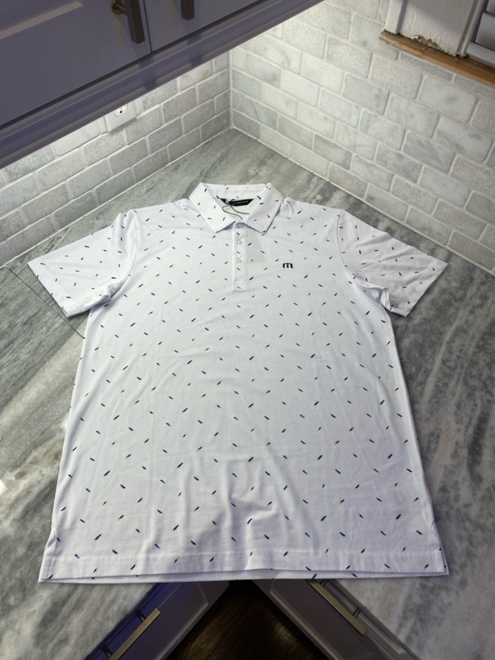 Travis Mathew White Polo with Navy Micro-Print